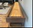 Custom leather wrapped exterior and interior walls of cradle in Distress Leather, Cradle Stain in Rich Walnut with Oil Rubbed Bronze Legs