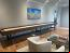 Custom leather wrapped exterior and interior walls of cradle in Distress Leather, Cradle Stain in Rich Walnut with Oil Rubbed Bronze Legs